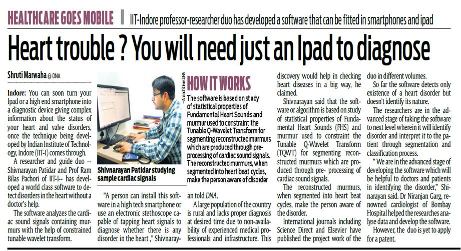 A person sitting at a desk with a book

Description automatically generated